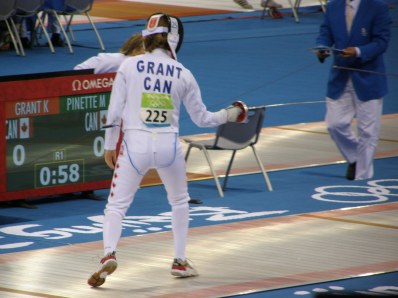 Grant brandished a sword in the pentathlon's fencing portion before placing 31st. Afterward she blasted any boycotting of the games. "The athletes have worked so hard to compete," she said. "Let them have their glory."